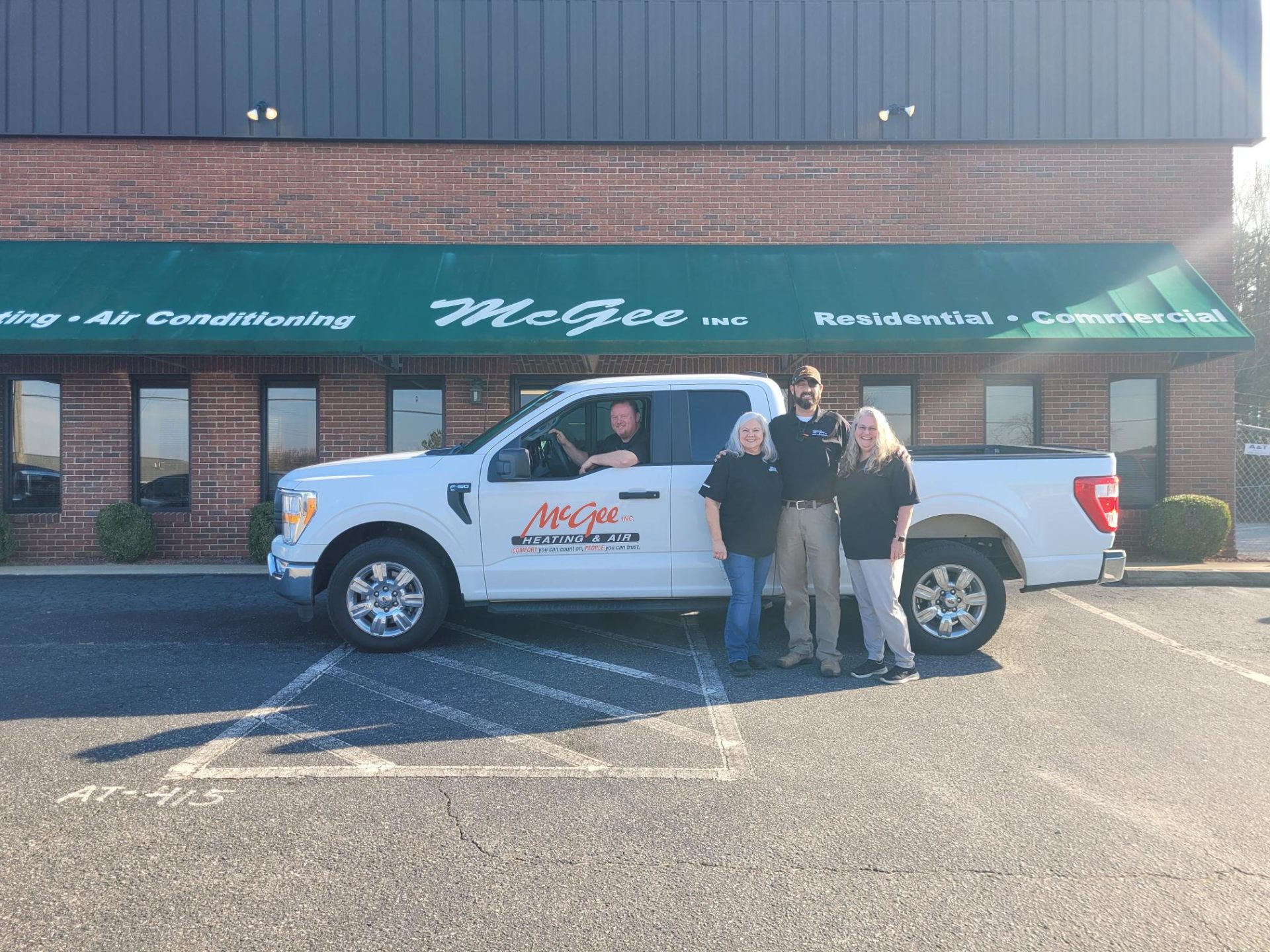 McGee Heating & Air team in front of their headquarters